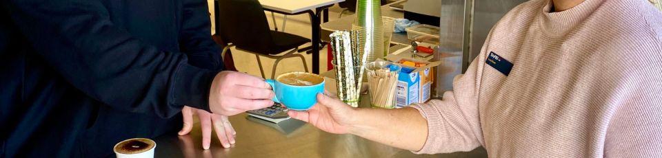 One skim cap, please! Great Lakes students trade textbooks for coffee cups